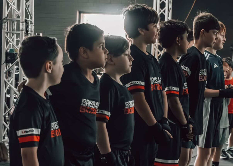 A Brisbane Boxing coach working with junior boxers.