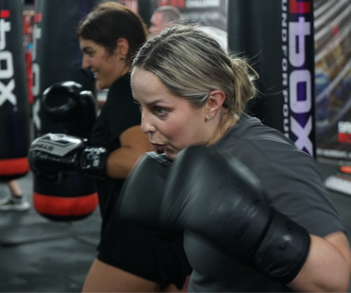 Training floor, boxing rings and hanging bags inside Brisbane Boxing Mt Gravatt / MacGregor.