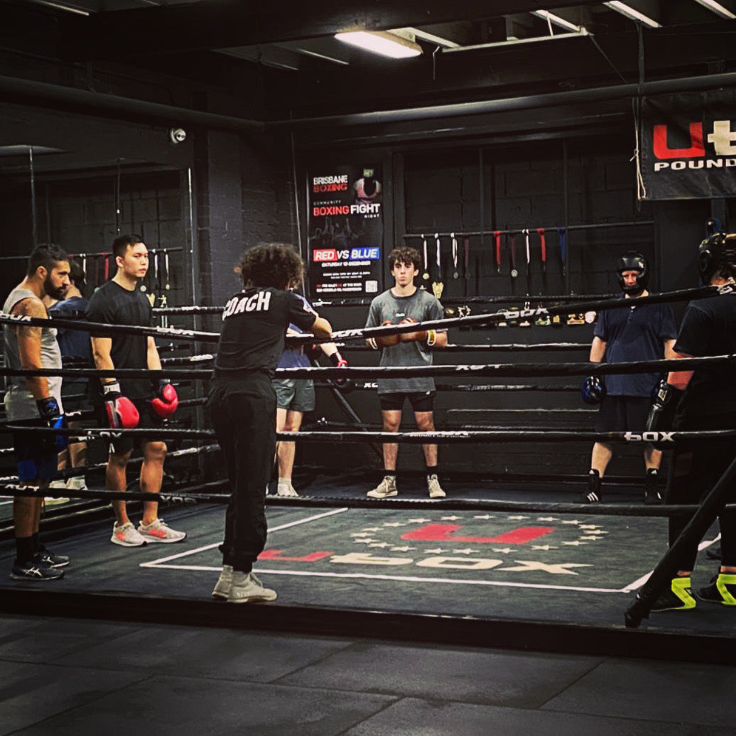 Training floor, boxing rings and hanging bags inside Brisbane Boxing Mt Gravatt / MacGregor.